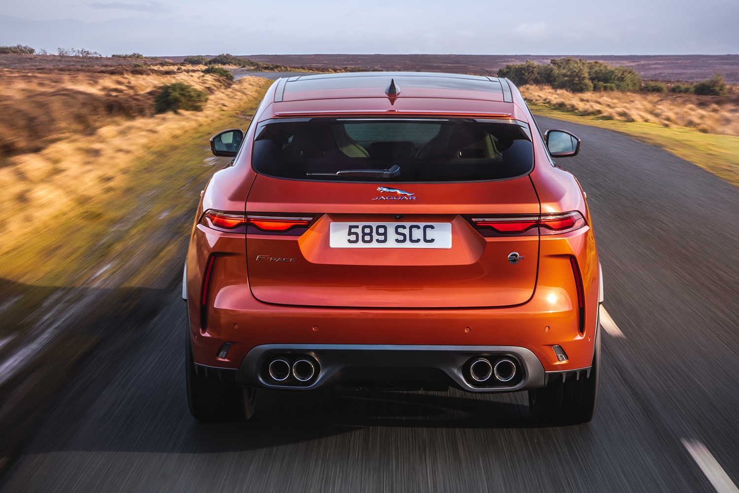 The rear end of the Jaguar F-Pace SVR SUV in orange