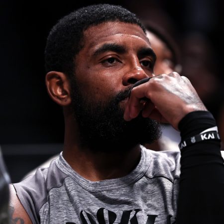 Kyrie Irving of the Brooklyn Nets looks on from the bench at Barclays Center.