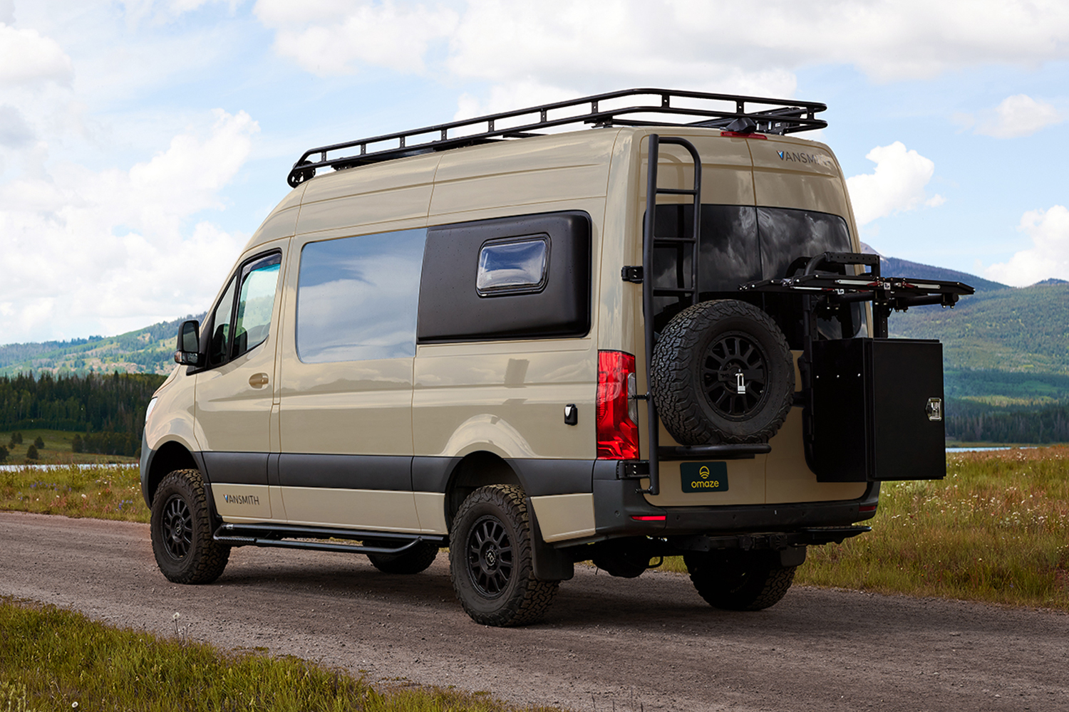 A tan and black Mercedes Sprinter Van converted into a home on wheels by Vansmith, which is currently up for grabs through Omaze