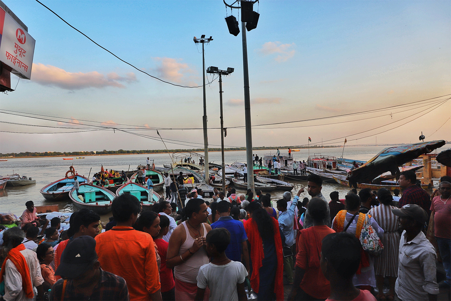 People and boats on the banks of the Ganges River in Varanasi, India