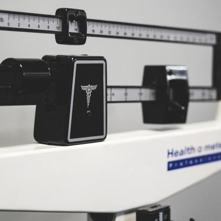 A close-up image of a scale. We take a look at a new fitness and wellness trend: accountability coaches.