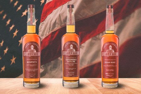 Three American Single Malts from Lost Lantern in front of an American flag