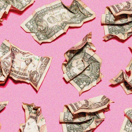 Pattern of crumpled one dollar bills lying against pink background