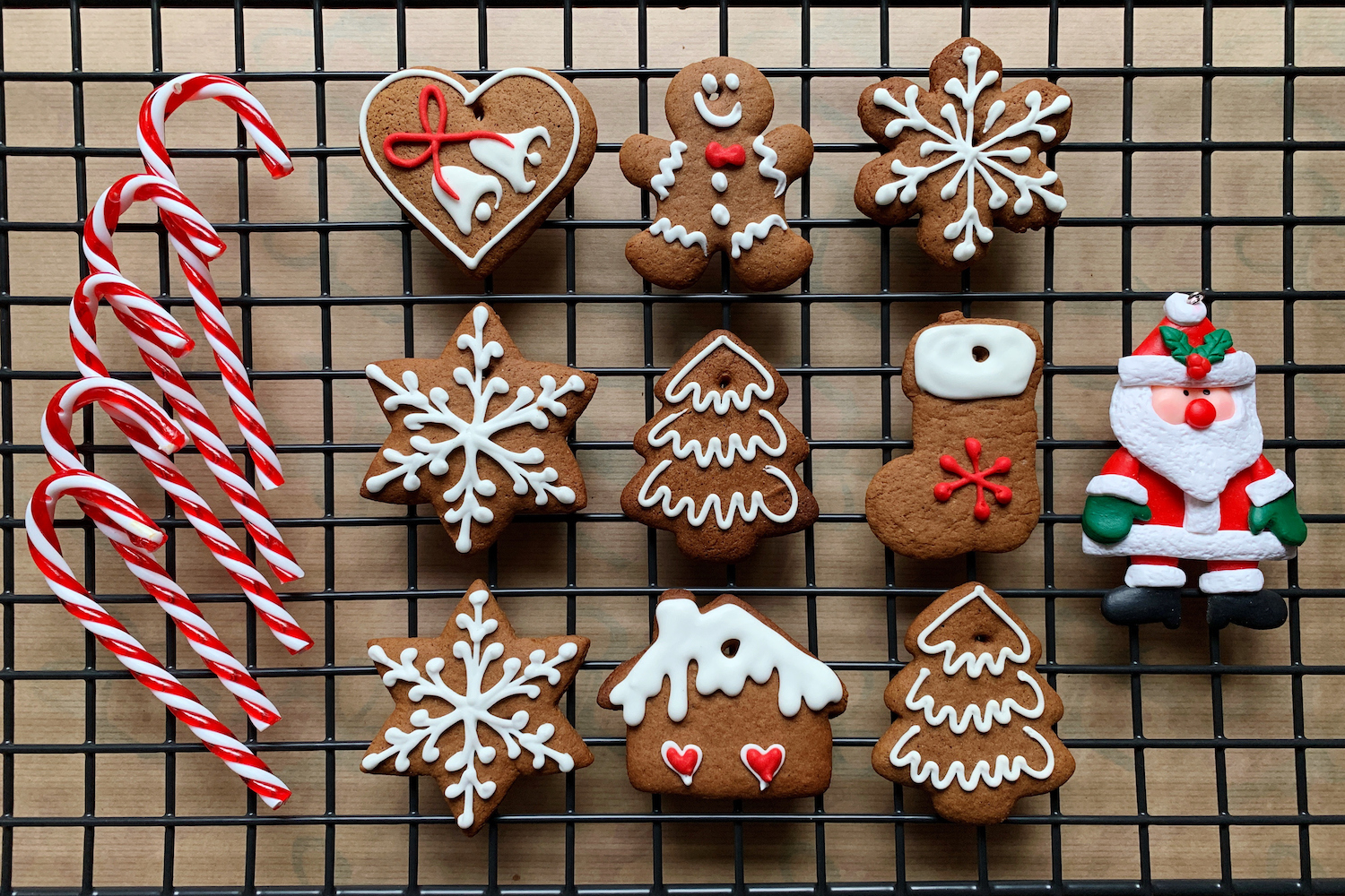 Christmas cookies and candy canes on a cooling rack