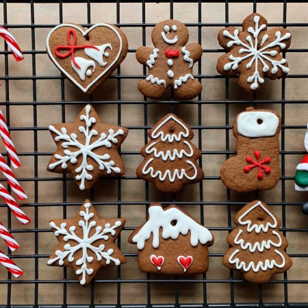 Christmas cookies and candy canes on a cooling rack