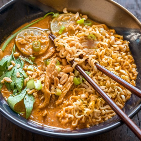 Ramen noodle soup with peanut sauce and chicken