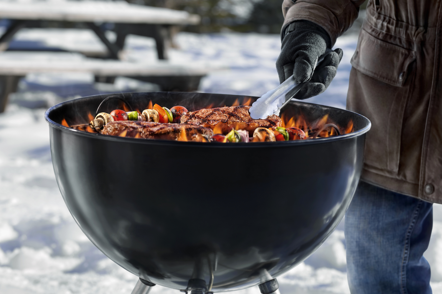 Cooking Steaks and Kababs on a Backyard BBQ in the Middle of Winter