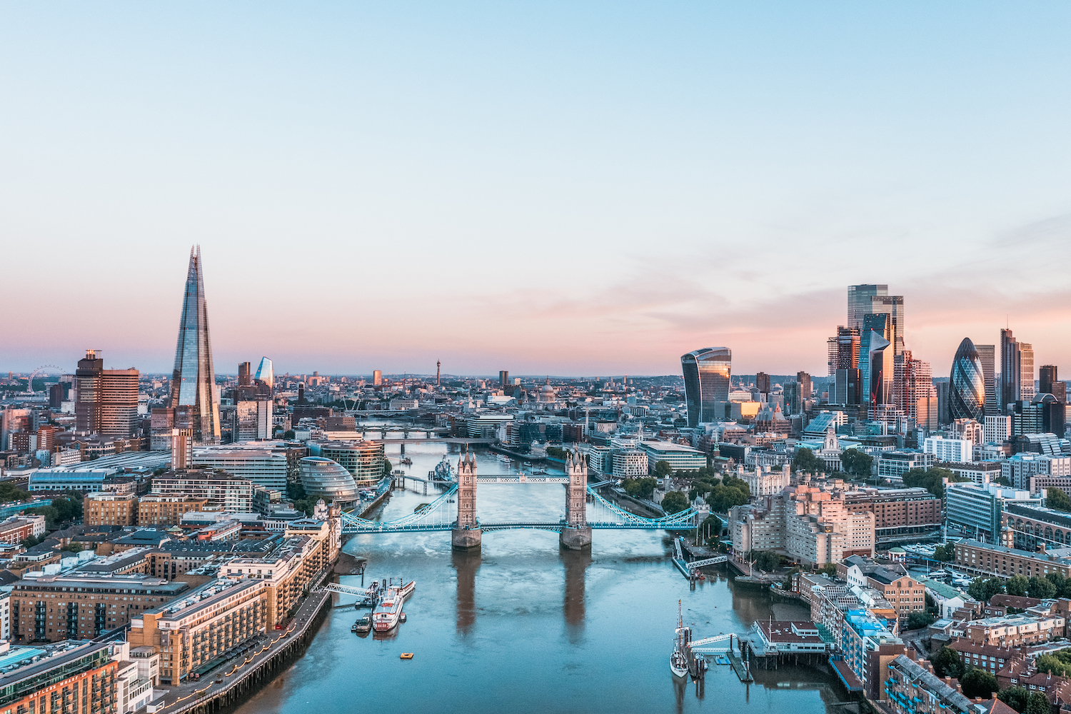 An elevated view of the London skyline at sunrise