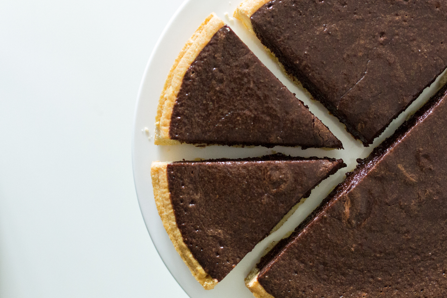 homemade chocolate pie with a piece cut out