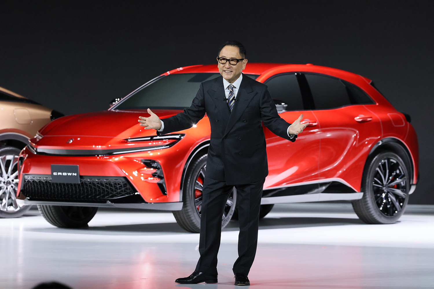 Akio Toyoda, president of Toyota, reveals the Crown lineup in July. None of them are currently all-electric.