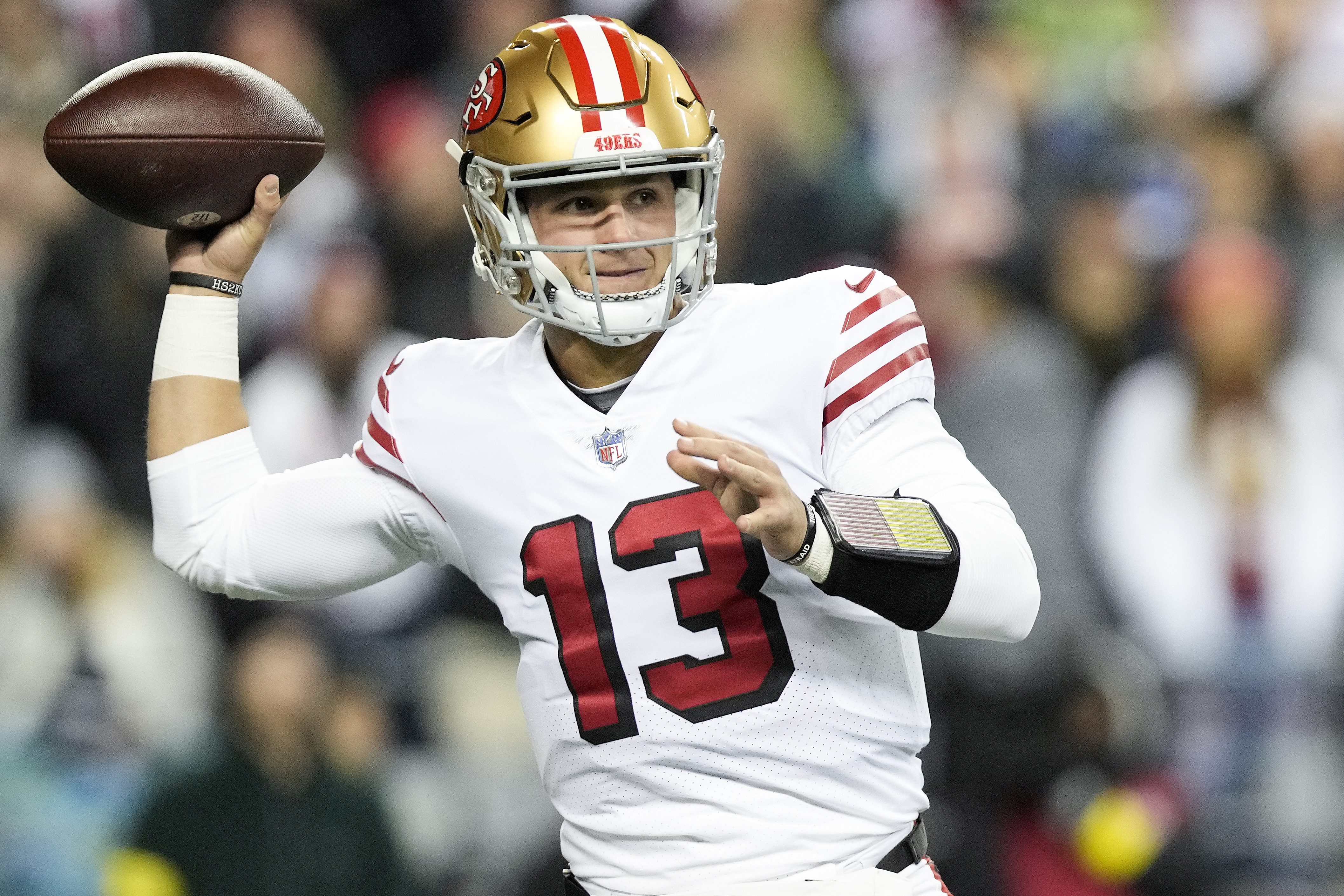 Brock Purdy throws a pass against the Seattle Seahawks.