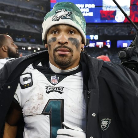 Jalen Hurts walks off the field after beating the New York Giants.