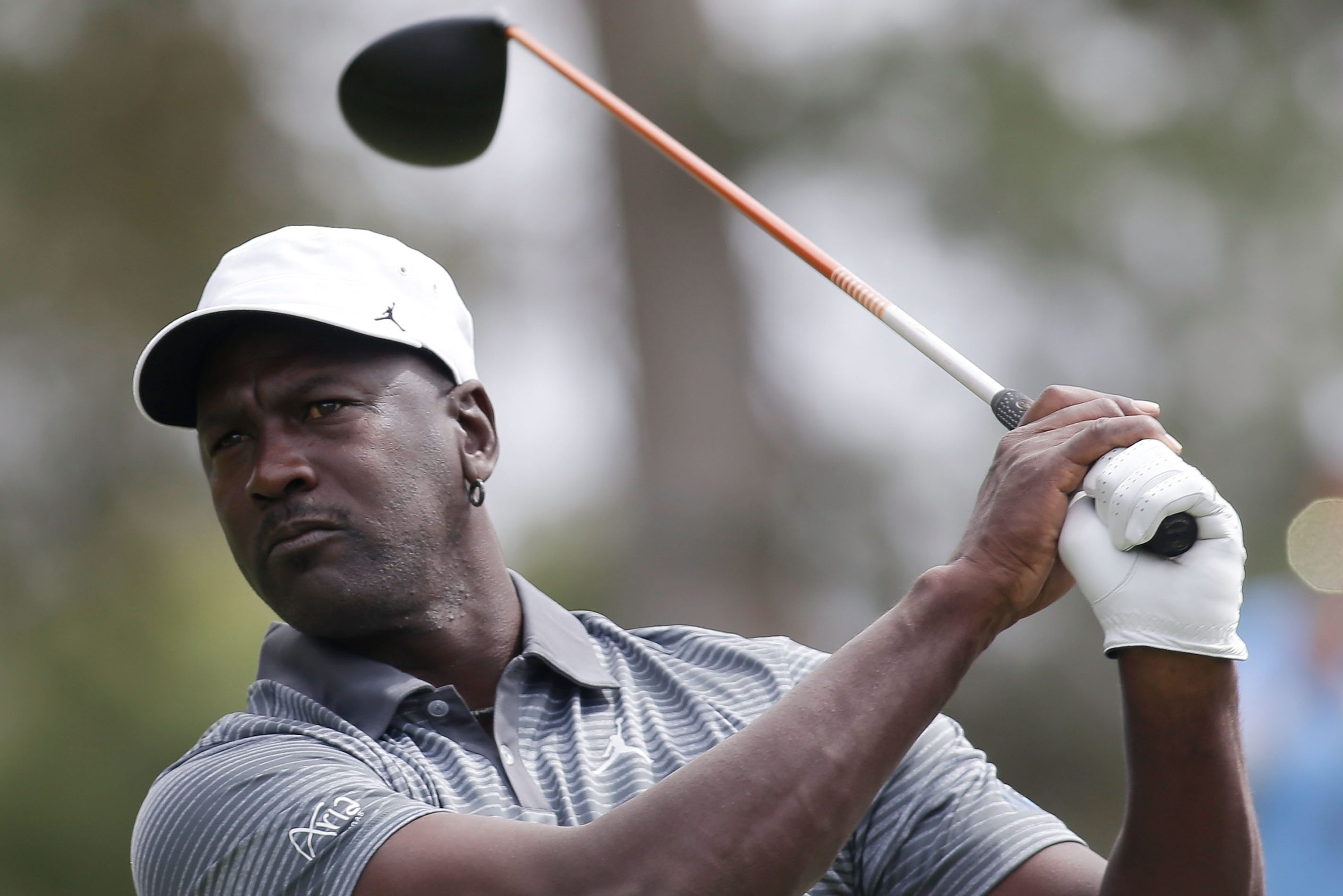 NBA legend Michael Jordan hits a tee shot in 2014 in Las Vegas. The Times revealed documents that show LIV Golf sought Jordan as a board member.