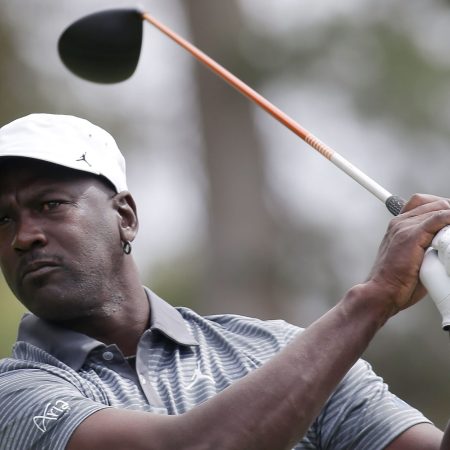 NBA legend Michael Jordan hits a tee shot in 2014 in Las Vegas. The Times revealed documents that show LIV Golf sought Jordan as a board member.