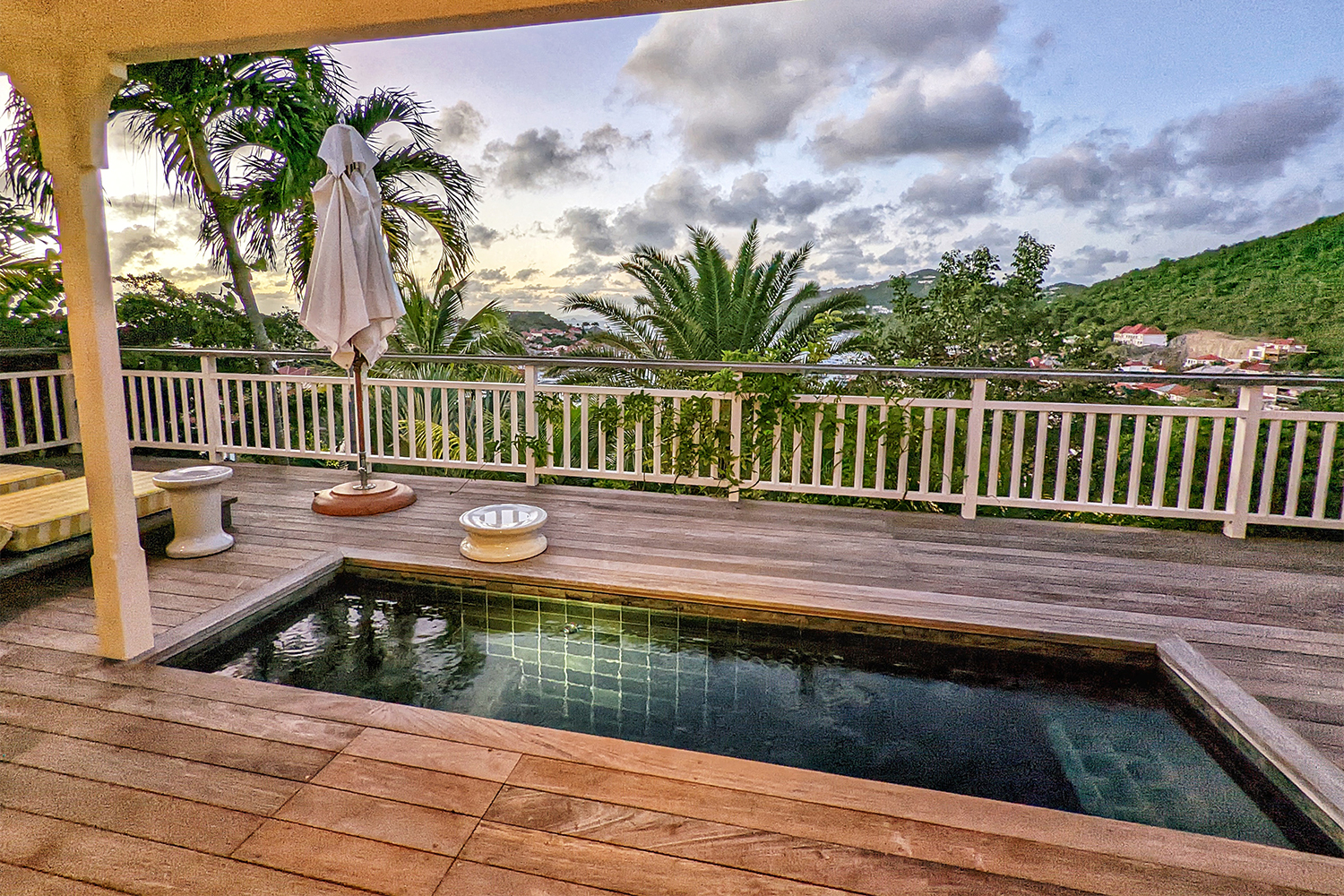 A private plunge pool and lounge chairs in a suite at Hôtel Barrière Le Carl Gustaf Saint-Barth