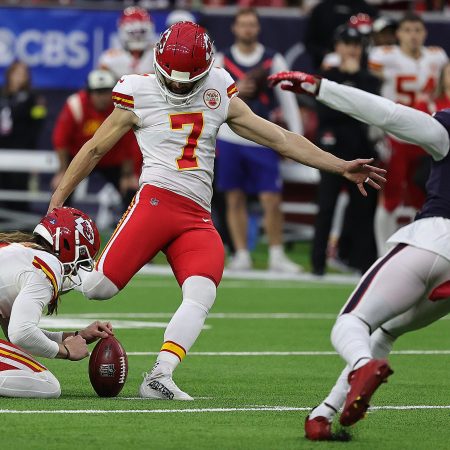 Harrison Butker of the Chiefs kicks a field goal in OT against the Texans.