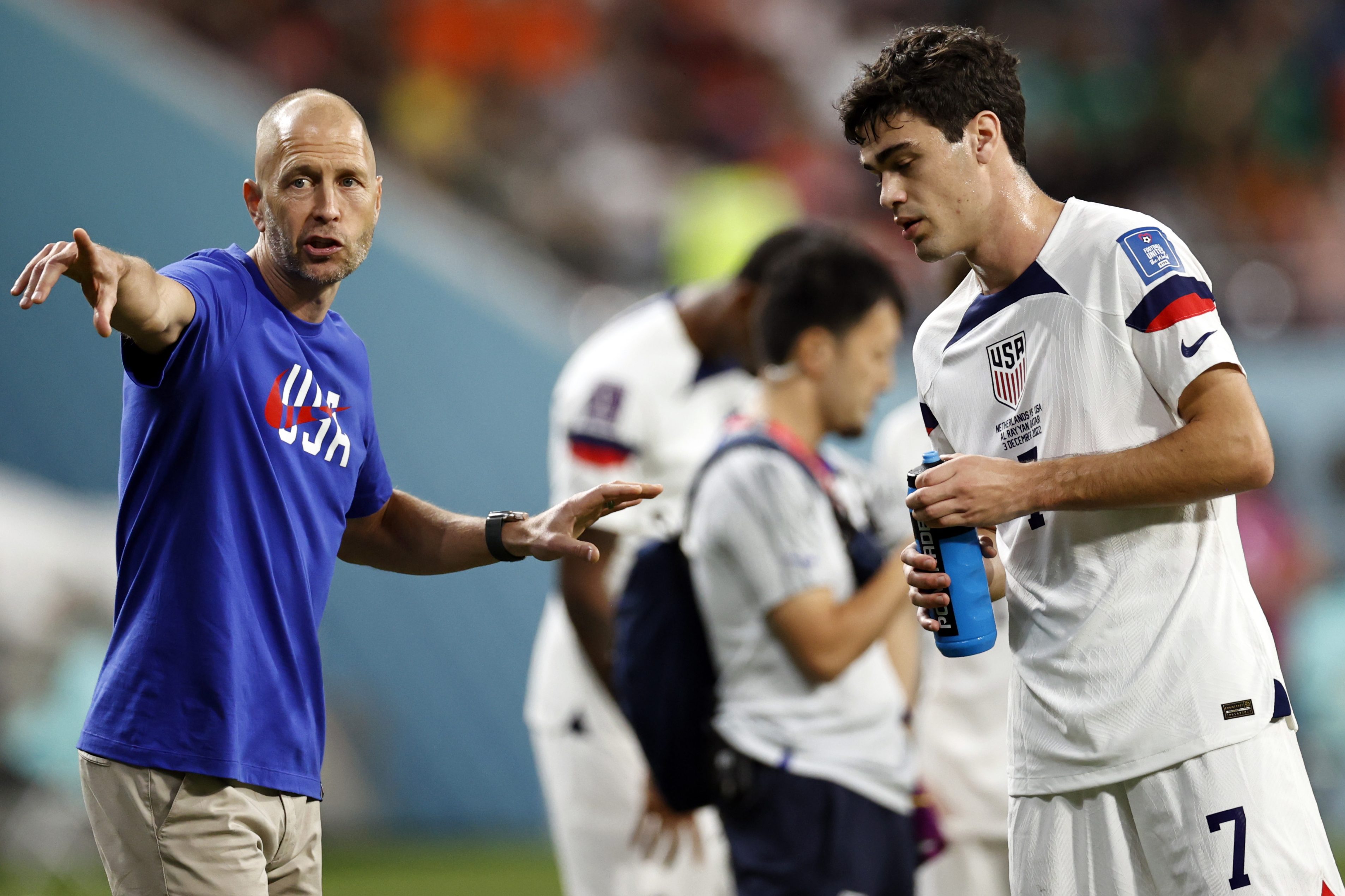 United States coach Gregg Berhalter with Giovanni Reyna in Qatar.