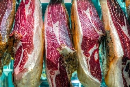 Jamon Iberico hanging In a Spanish Market