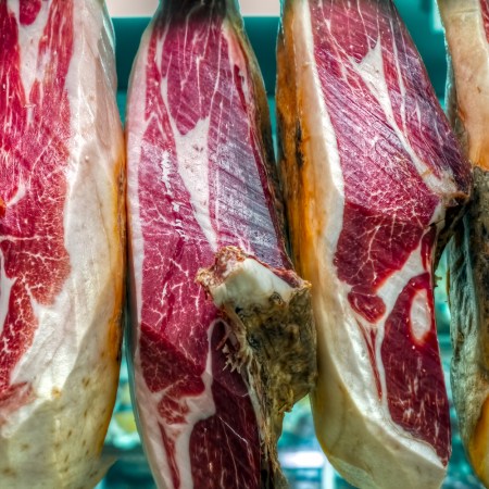 Jamon Iberico hanging In a Spanish Market