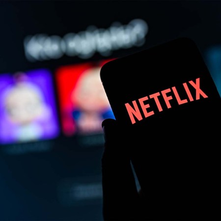 A Netflix logo seen displayed on a smartphone. The streaming platform is hiring flight attendants for its fleet of private jets.