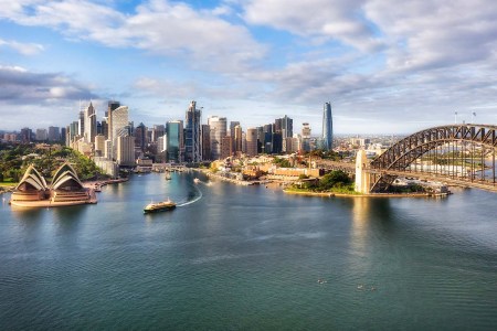 Waterfront architectural landmarks of Sydney city CDB around Circular quay and the Rocks on shores of Harbour in aerial cityscape