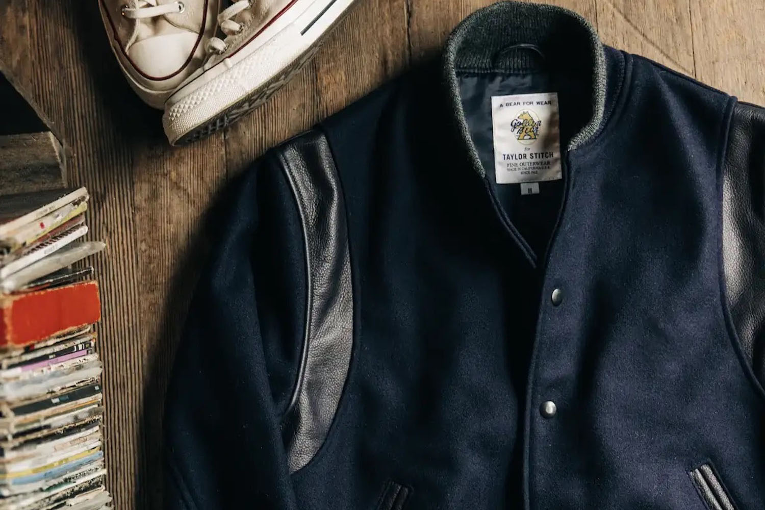 a Taylor Stitch leather jacket on a wooden background