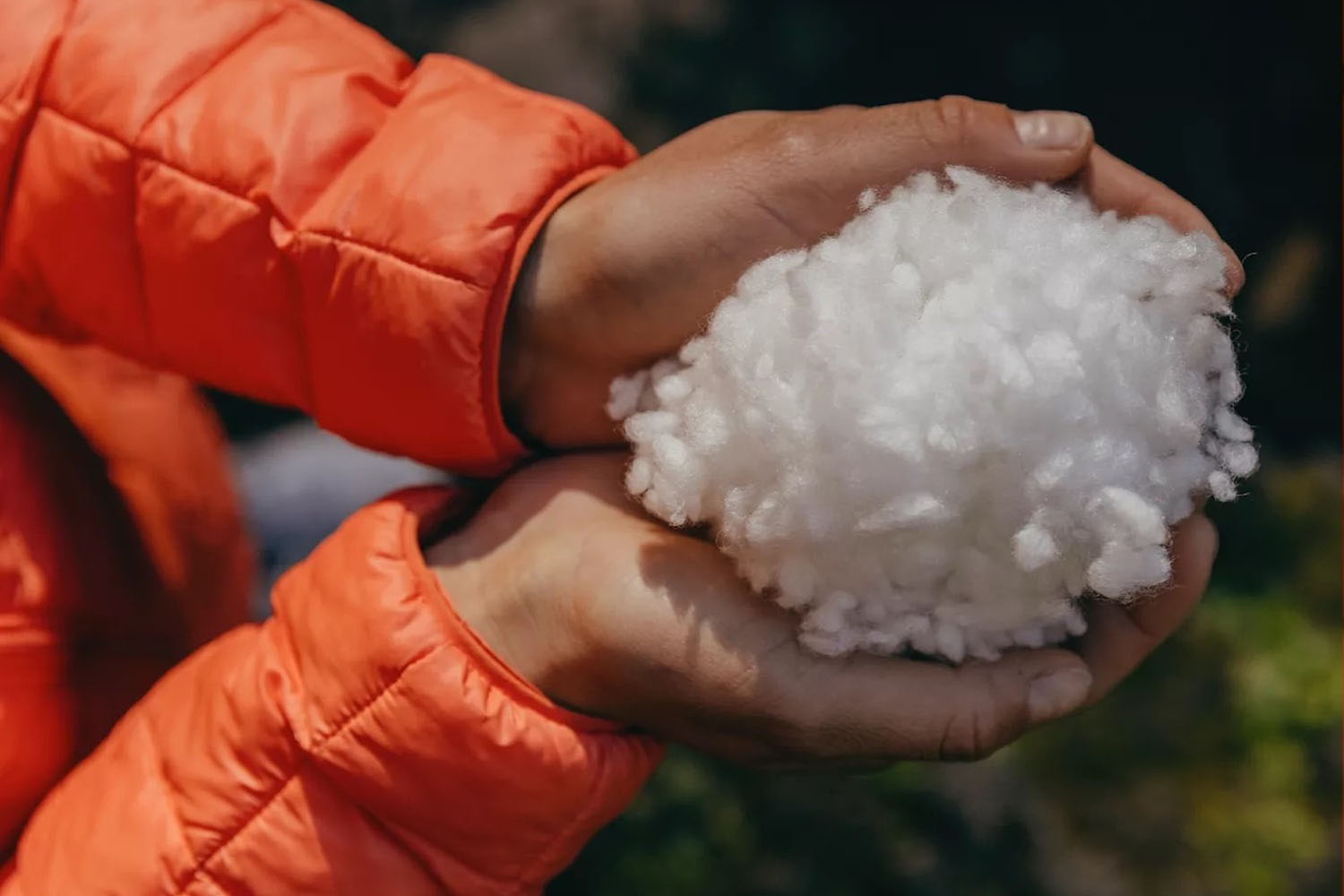 a model holding The North Face Thermoball material