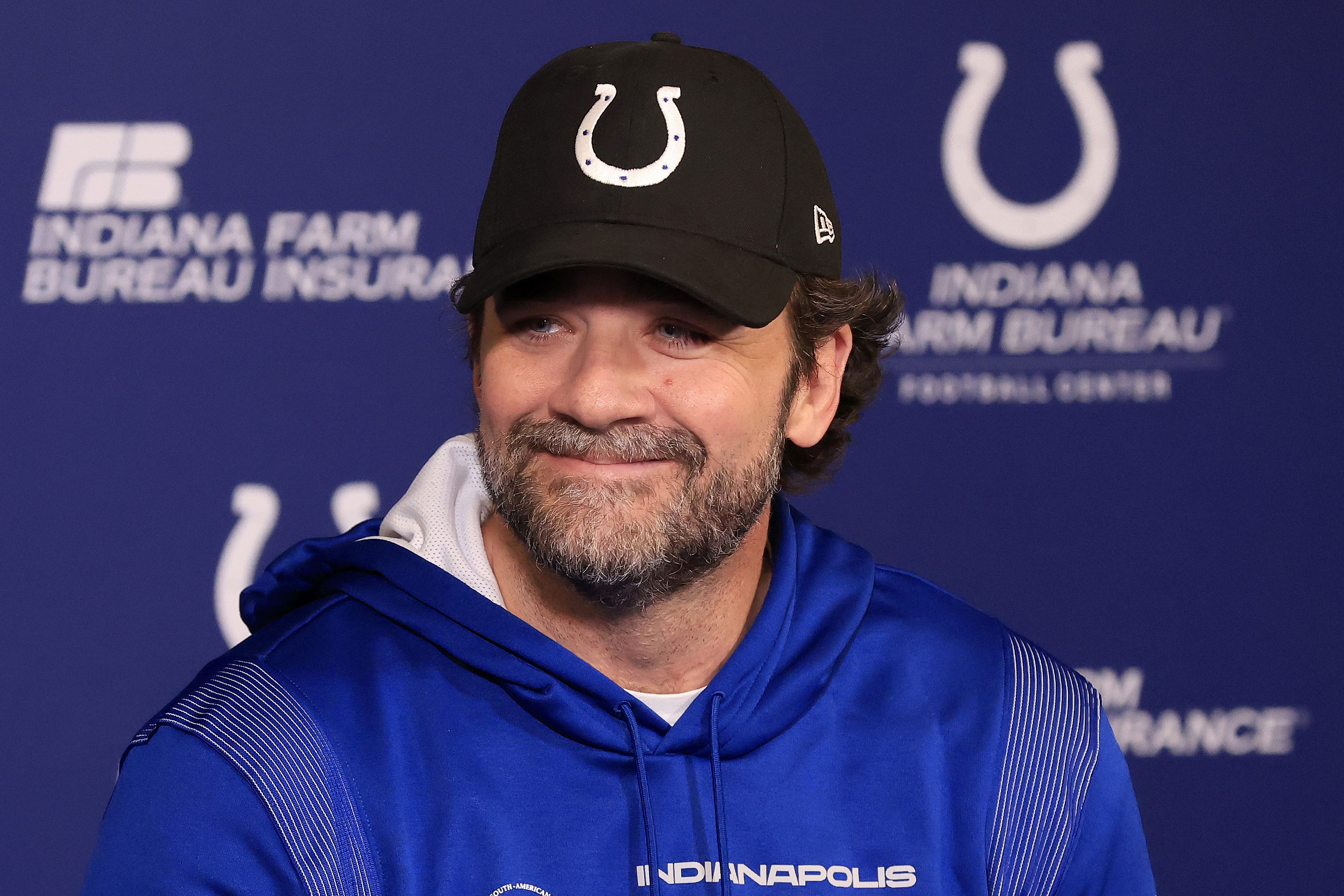 Jeff Saturday talks to the media at a press conference.