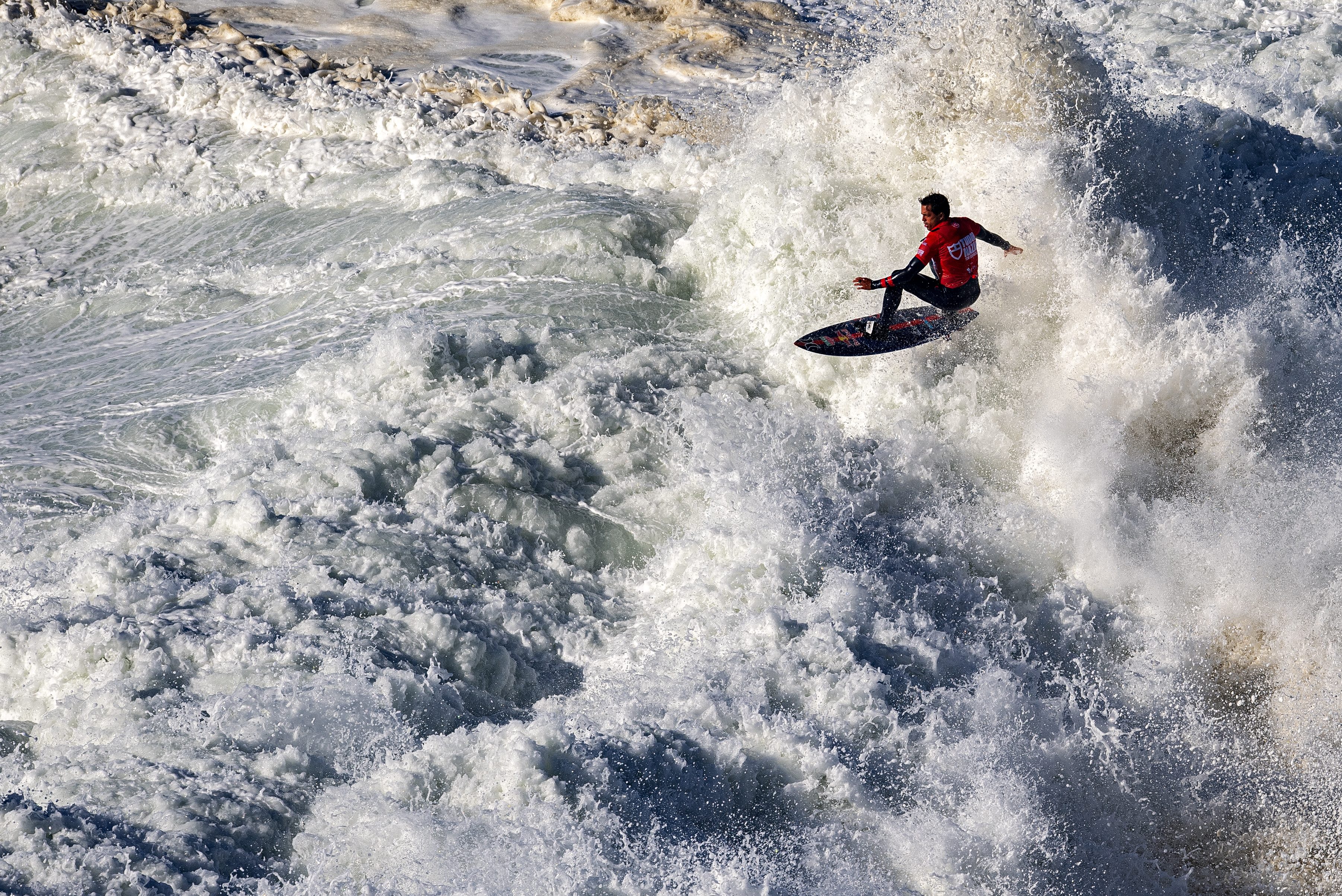 Kai Lenny rides a wave during the TUDOR Nazare Tow Surfing Challenge in 2021.