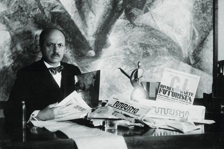 Filippo Tommaso Marinetti Sitting At A Desk