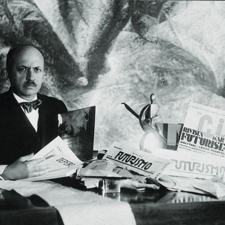 Filippo Tommaso Marinetti Sitting At A Desk