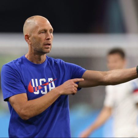 Gregg Berhalter gives directions at the World Cup against the Netherlands.