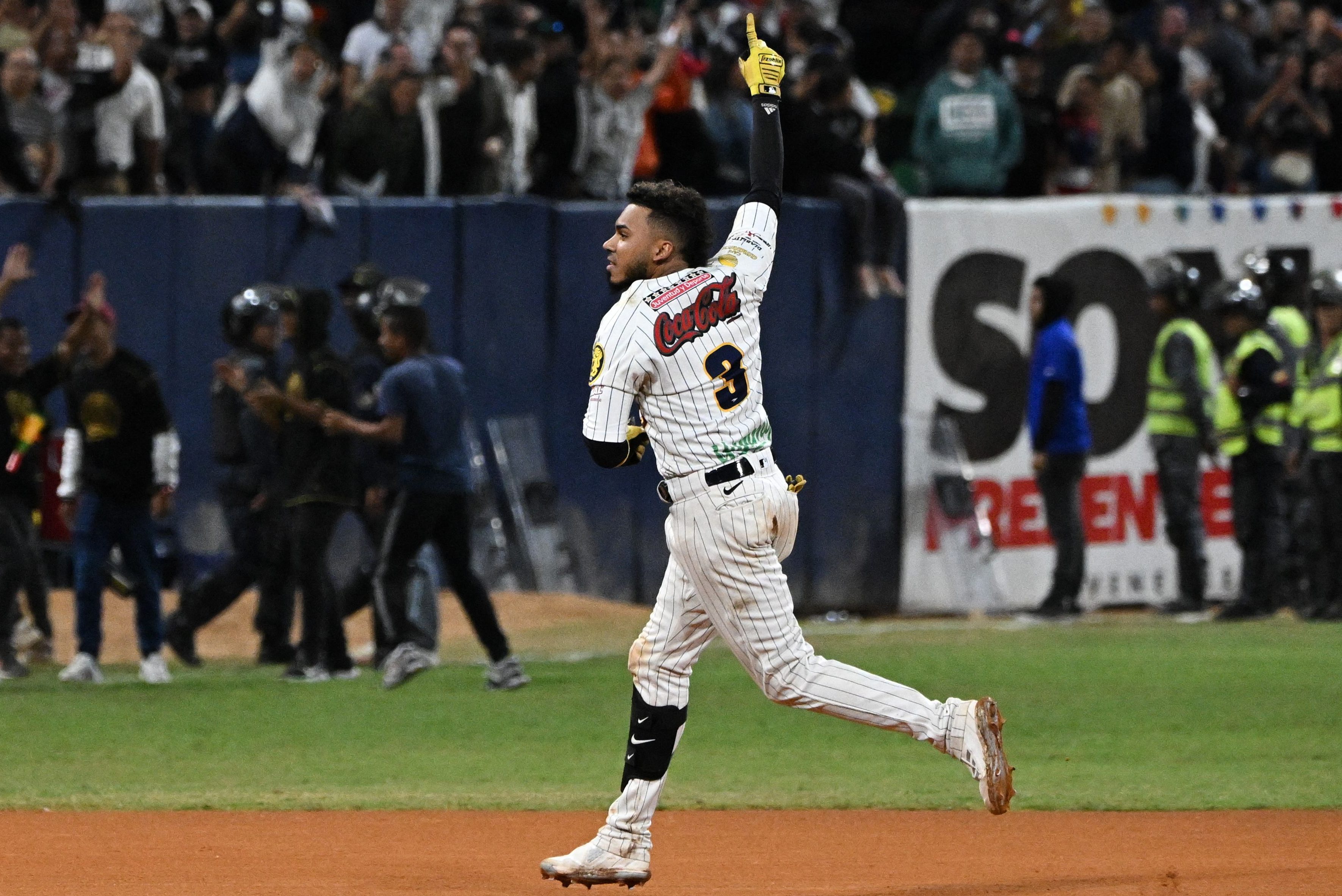 Harold Castro of Leones del Caracas reacts after hitting a home run.