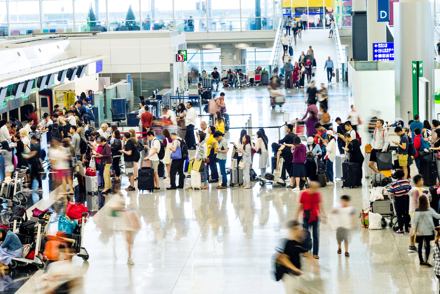 Crowd of people waiting for check-in at the airport