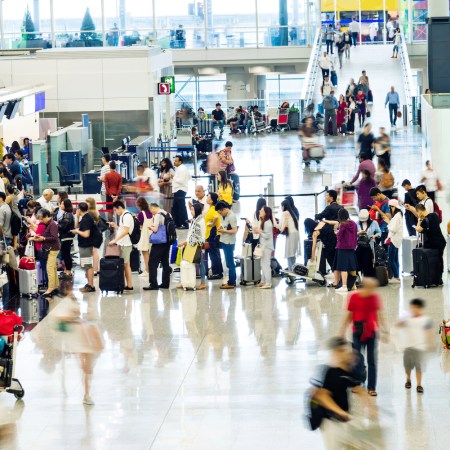 Crowd of people waiting for check-in at the airport