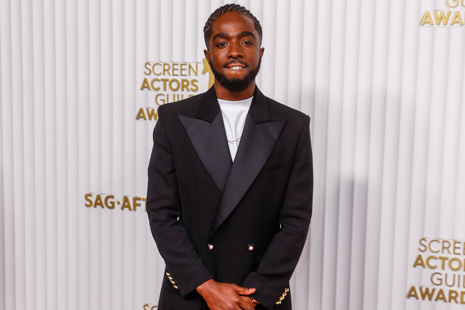 a photo fo Calbe McLuaghklin at the 2023 SAG Awards red carpet