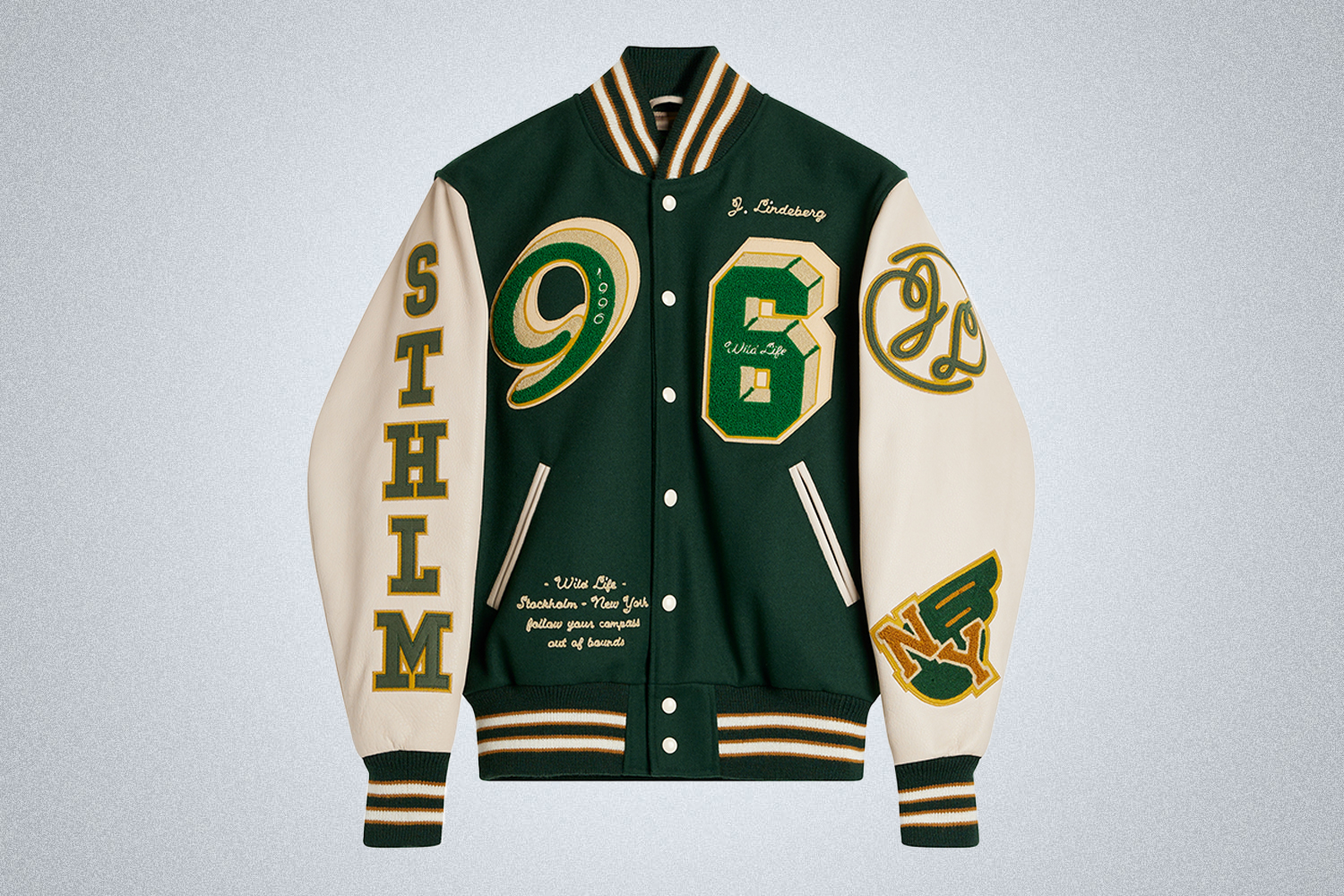 a green and white J.Lindberg Varsity Jacket on a grey background