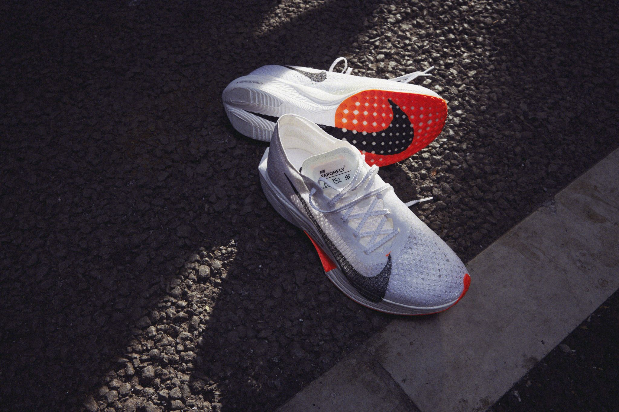 a pair of Nike Vaporfly 3 running shoes on a black and white background