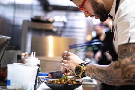 Robbie Felice cooking in the kitchen as Pasta Ramen.