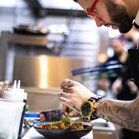 Robbie Felice cooking in the kitchen as Pasta Ramen.