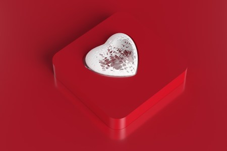 Abstract white heart shape made from torn walls inside a red box.