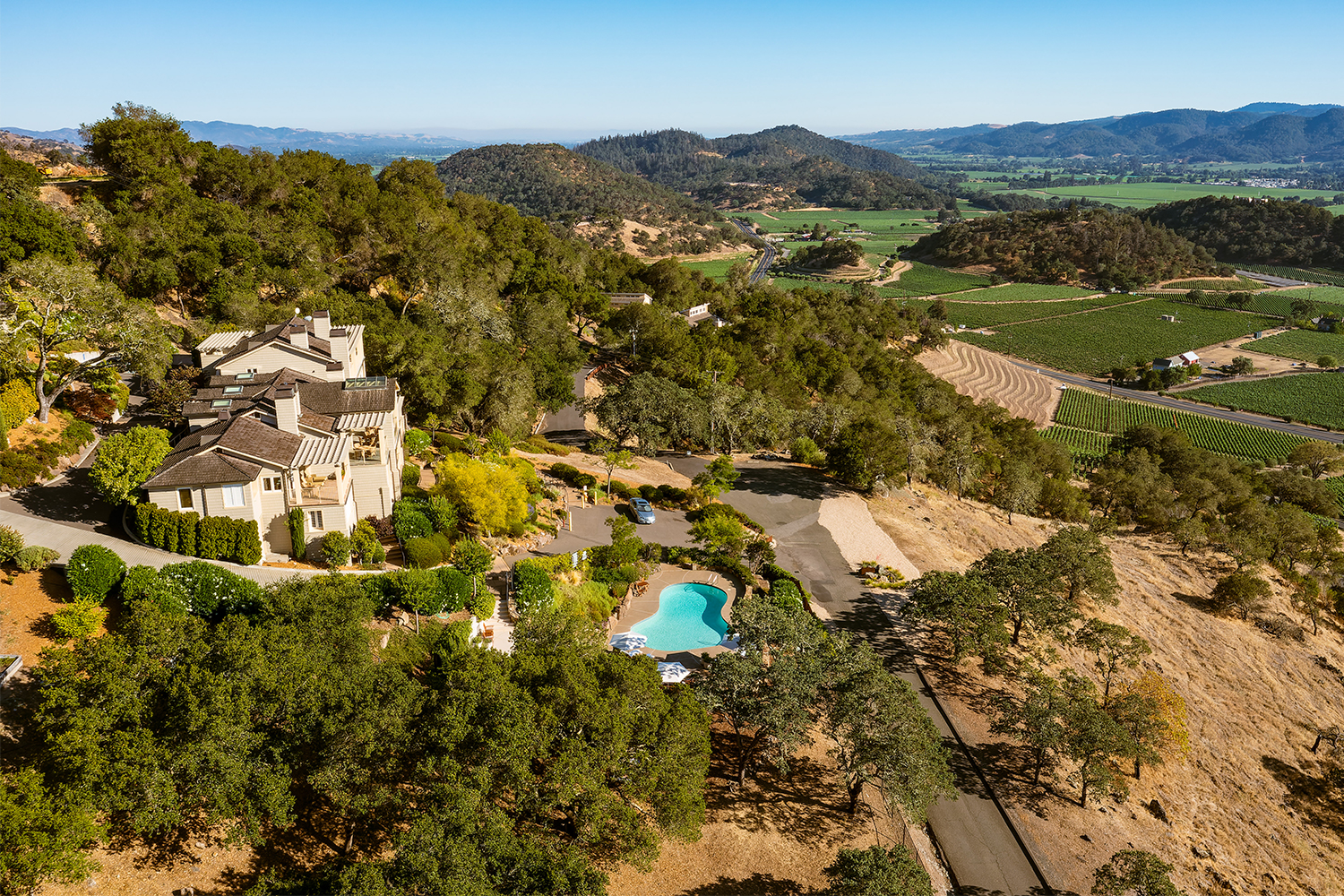 Poetry Inn in Napa Valley, seen here with a pool looking over vineyards. We recently visited and reviewed the manor.