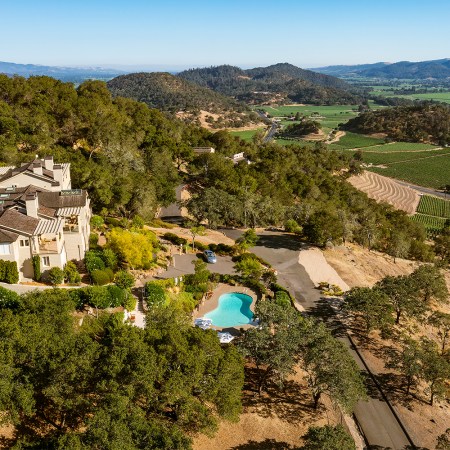 Poetry Inn in Napa Valley, seen here with a pool looking over vineyards. We recently visited and reviewed the manor.