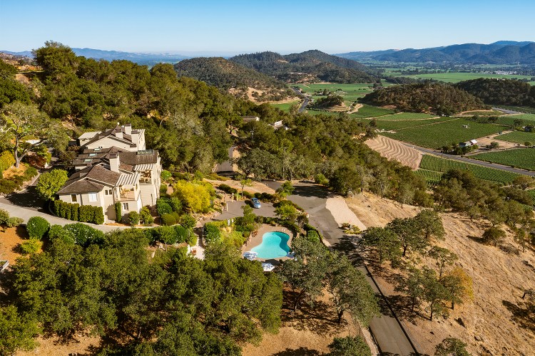 Poetry Inn in Napa Valley, seen here with a pool looking over vineyards. We recently visited and reviewed the manor.