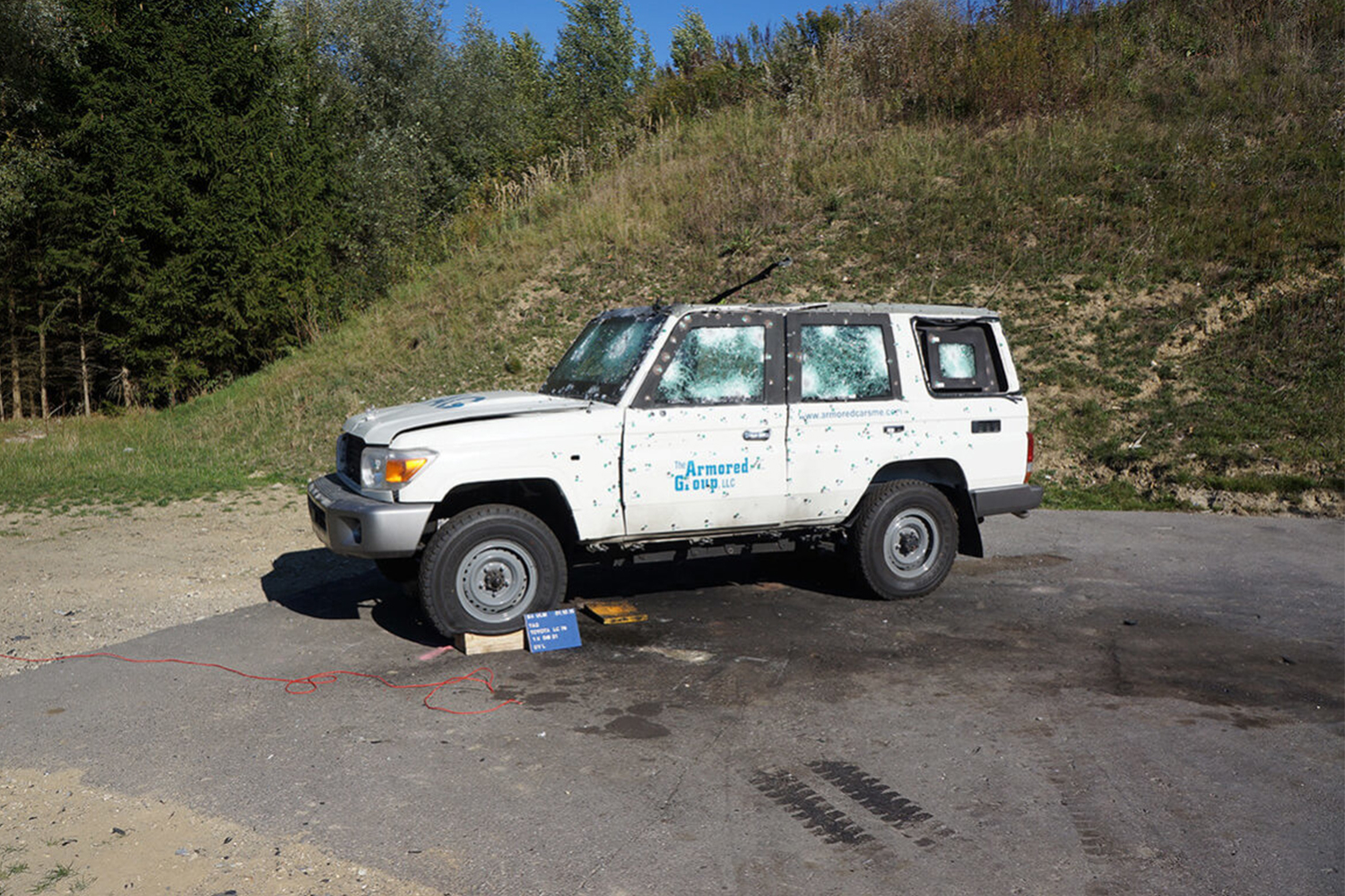 An armored Toyota Land Cruiser that's been shot with bullets during testing from The Armored Group