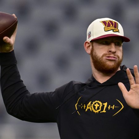 Carson Wentz warms up before a game against the Bears.