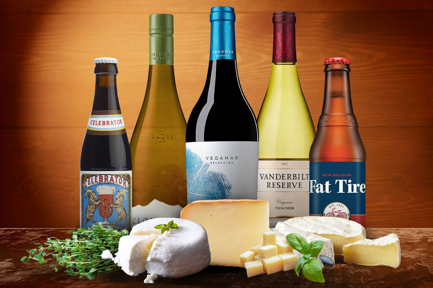 a bunch of wines, beers and cheese on a wooden background