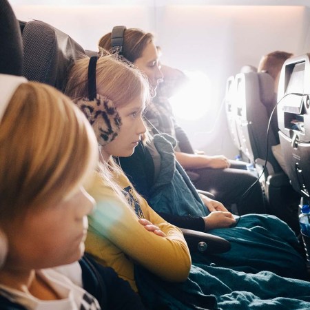 Family sitting together on a plane