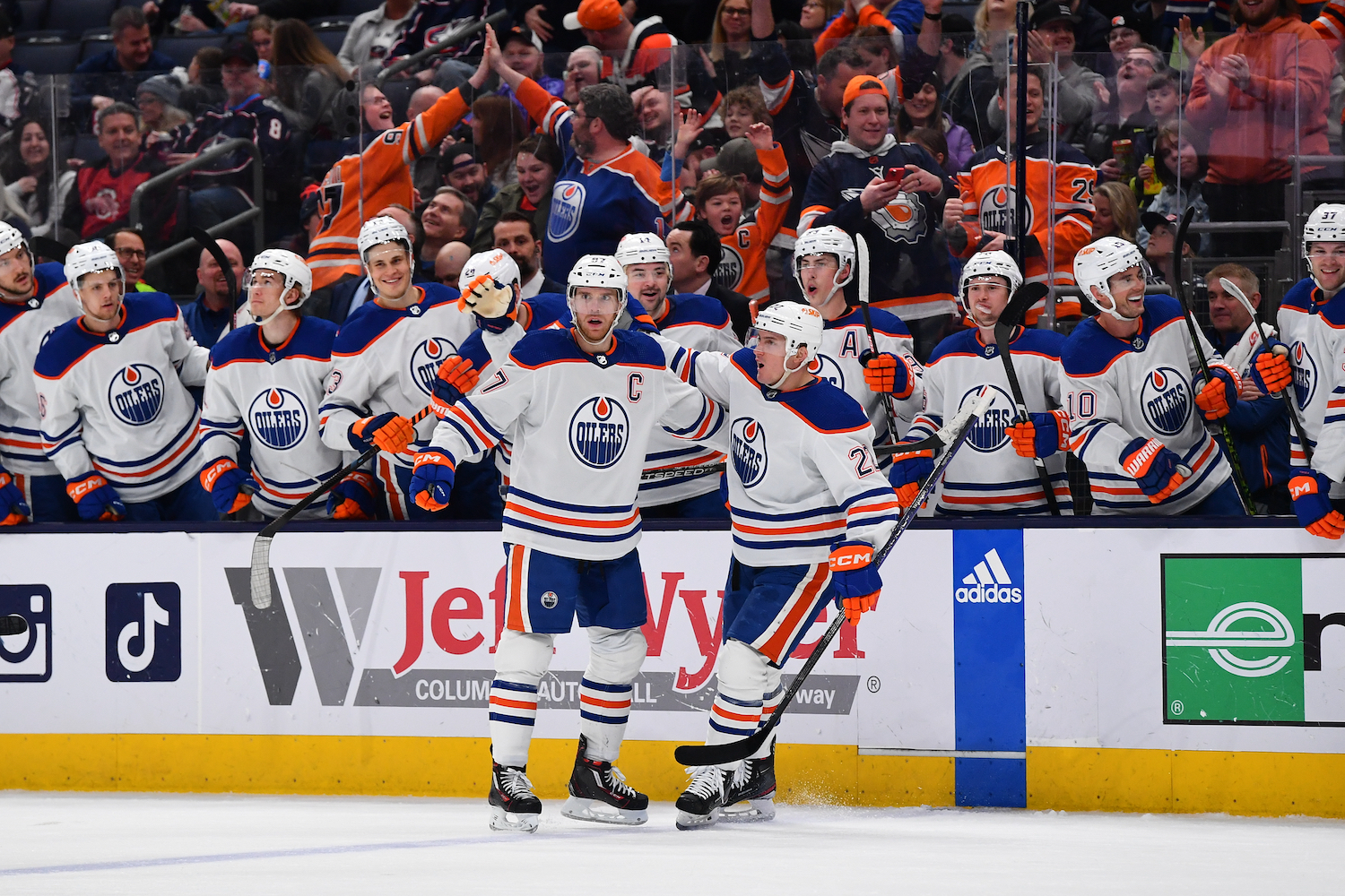 Connor McDavid celebrates a goal with teammates