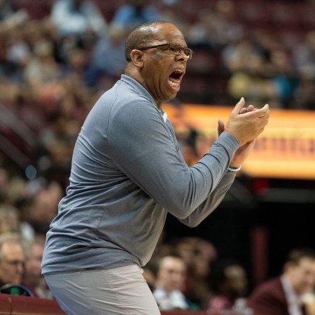 Hubert Davis, head coach of the UNC Tar Heels, yells instructions to his players from the sideline